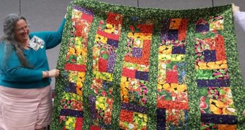 Nancy tells the story of found fabric that a friend made into a Fruit and Veggies quilt. What a friend!